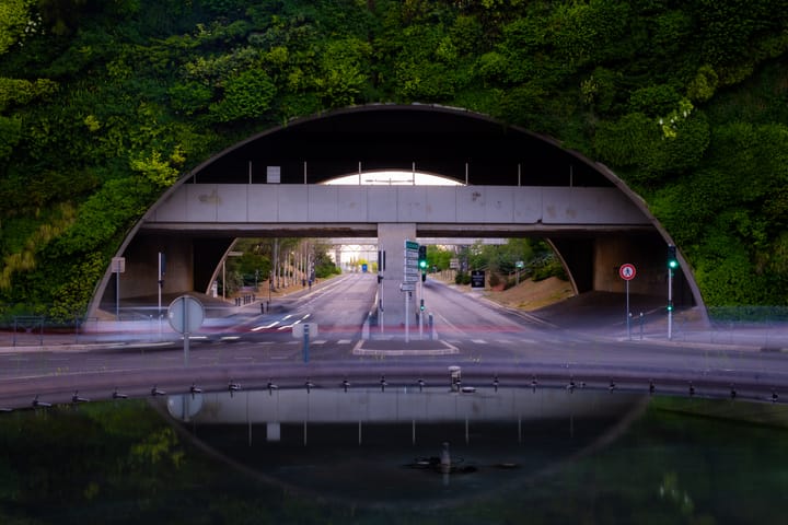 A roundabout with plants on the wall